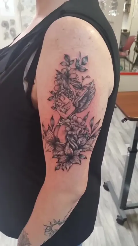 Floral shoulder piece shown from the purple stencil to the finished black and gray